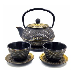 Juego de tetera con vasos negro y dorado